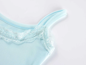 Detailed close-up of light blue modal camisole with delicate lace trim and ribbed texture
