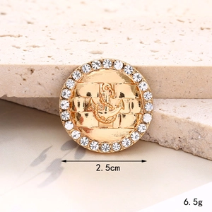Luxurious gold anchor shoe charm with sparkling rhinestones and 2.5cm diameter size