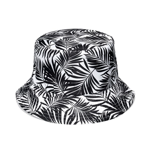 Close-up of tropical palm leaf print on high-quality black and white bucket hat