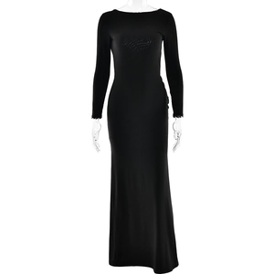 Detail of a sleek black long sleeve backless maxi dress with a slim fit and elegant silhouette