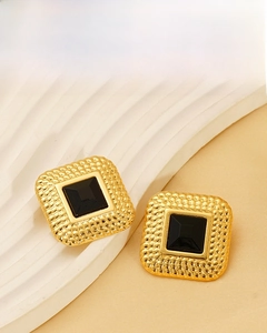Detail of 18K gold plated vintage square earrings featuring black resin and rope texture