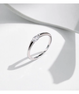 Macro view of an irregular silver s925 ring featuring a marquise-cut sparkling zircon