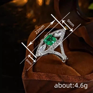 Elegant emerald cut green gemstone ring with marquise white cubic zirconia accents