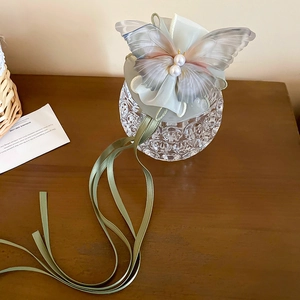 Elegant tulle bow hair claw with faux pearls and long ribbons in sage green