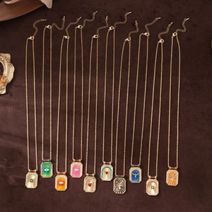 Collection of ten vintage gold-plated tarot square necklaces with colorful enamel motifs
