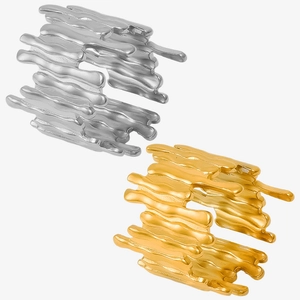 Detailed macro view of liquid metal lava style rings in gold and silver finish