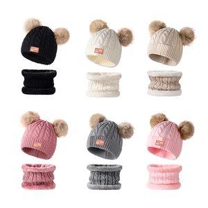 Detail of winter knit cable hat and scarf sets for kids in six different colors