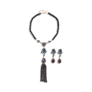 Vintage boho jewelry set with purple crystal pendants, black beads, and tassel necklace