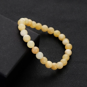 Natural chalcedony beaded bracelet with smooth round beads on black jewelry box