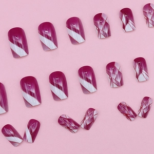 Pink and purple geometric plaid pattern glue-on false nails set in a grid design
