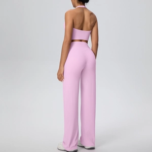 Back view of pink halter sports bra and high-waisted wide-leg yoga pants set
