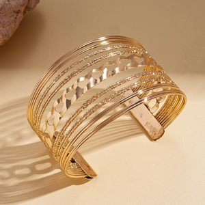 Chic multi-layer hollow heart cuff bracelet in polished gold finish for women