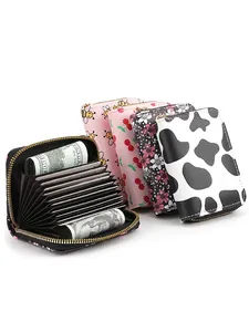 Slim accordion card wallet with floral and animal prints featuring multi-slot interior