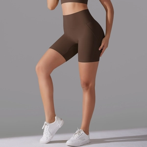 Close-up of coffee brown high-waisted fitness shorts with seamless shaping effect
