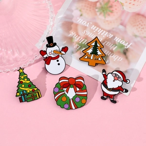 Detailed set of cute enamel Christmas pins including Santa, snowman and Xmas trees