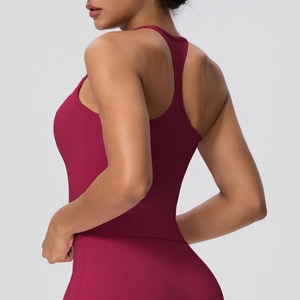 Detail view of burgundy racerback sports bra with high-elastic fabric and slim fit design