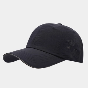 Detail view of laser-cut star perforations on breathable black nylon baseball cap