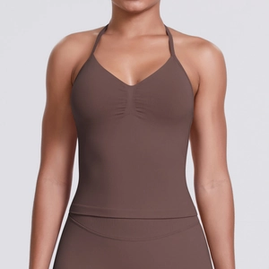 Detail of chocolate seamless yoga top showing the ruched chest and halter neck design
