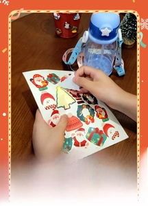 Close-up of easy-to-peel Christmas cartoon stickers showing no-residue feature