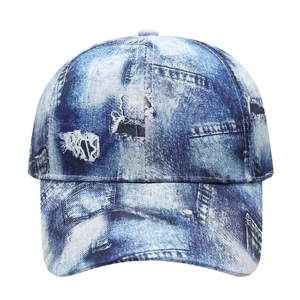 Retro denim style baseball cap with distressed hole patterns and blue tie-dye texture