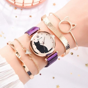 Detailed view of women's quartz watch set with cat dial and golden bracelets