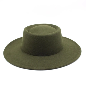 Detail of dark olive green wide-brim wool fedora hat with a flat top and stiff structure