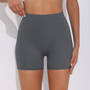 Macro detail of high-waisted seamless charcoal grey sports shorts with tummy control