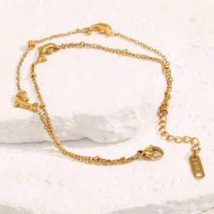Detail of 18K gold-plated double-layer chain with three 3D dolphins and lobster clasp