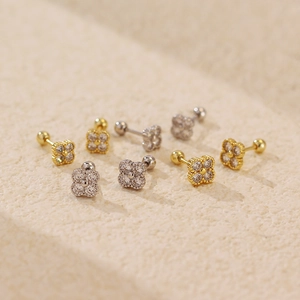 Vintage S925 silver four-leaf clover stud earrings with sparkling diamonds in gold and silver