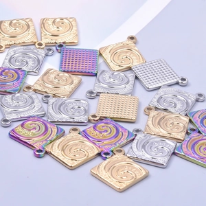 Square stainless steel charms with spiral and grid patterns in gold, silver, and rainbow