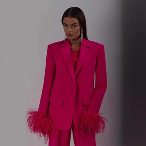 Fuchsia suit set with blazer featuring ostrich feather cuffs and wide leg pants