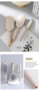 Detail of rose gold scalp massage hairbrush with anti-static bristles and bear ear design