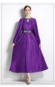 Close-up of a purple pleated dress featuring a diamond-embellished collar and matching belt