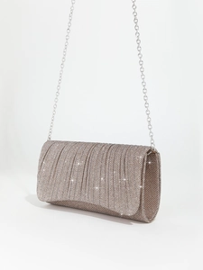 Detailed side view of champagne glitter pleated evening clutch with silver chain strap