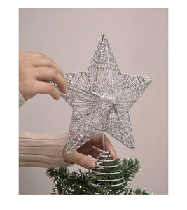 Detailed close-up of a silver hollow metal star tree topper with glitter finish