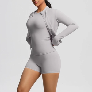 Detail of high-stretch light grey 3-piece yoga set including jacket and fitness shorts