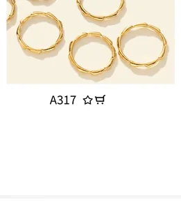 Macro detail of gold stackable rings featuring a distinctive bamboo texture and polished finish