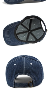 Detailed view of dark blue denim baseball cap showing cotton interior and metal buckle