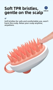 Detail showing soft TPR bristles on pink scalp massage brush with a comfortable grip