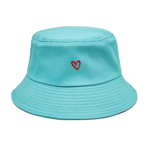 Detail of light blue cotton bucket hat featuring small red heart embroidery texture