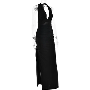 Detail view of the deep V-neck and halter neckline on a black side slit maxi dress
