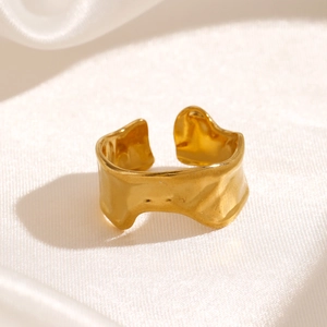 Golden irregular wavy ring with hammered texture in stainless steel for women