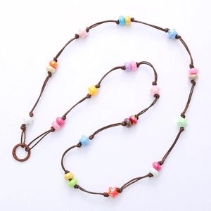 Handmade brown braided acrylic star crossbody phone lanyard with colorful beads and metal ring