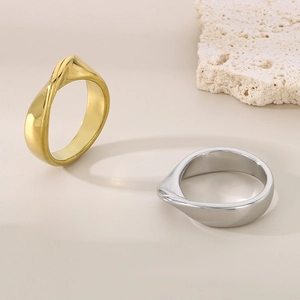 Minimalist irregular twisted stainless steel rings in gold and silver finish