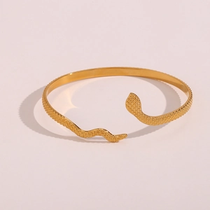 Detailed view of the 18K gold-plated snake cuff bracelet with intricate scale texture