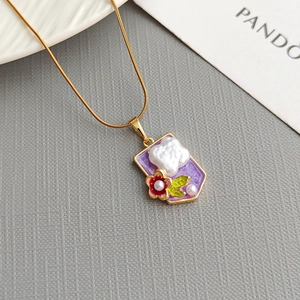 Elegant gold necklace with purple enamel pendant, baroque pearl, and flower charm details