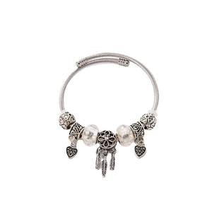 Adjustable dreamcatcher wire bracelet with silver feather pendants and glass beads