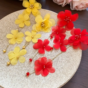 Floral fabric tassel drop earrings in bright yellow and red with gold metal chains