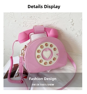 Detailed close-up of a pink patent leather creative vintage telephone crossbody bag