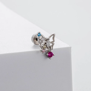 Silver butterfly earring with colorful zircons on a white minimalist display